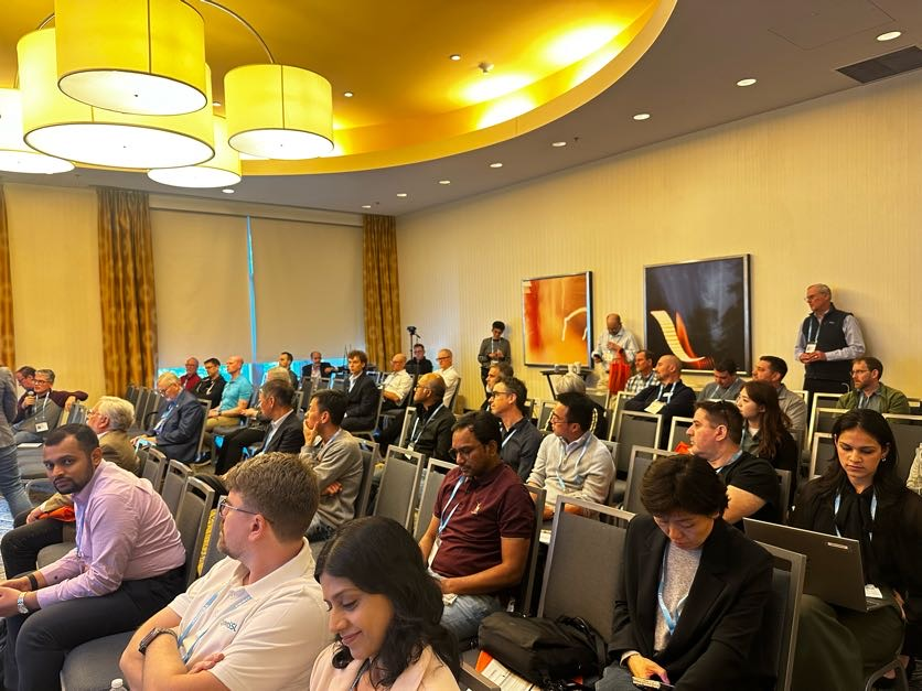 ICMC 2026 delegates seated in the session room